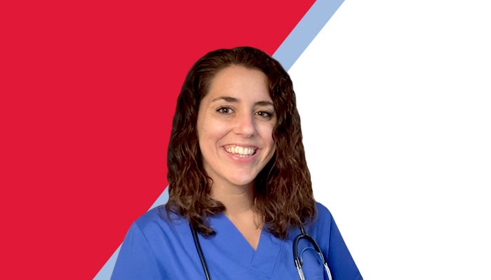 Smiling photo of Shelby, a woman with curly brown hair, wearing blue scrubs with a stethoscope round her neck.